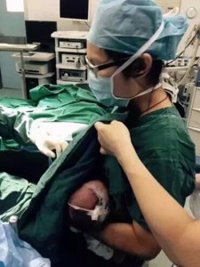 Pic shows: during surgery, Baoxia breastfeeds the boy. A nurse has been applauded for offering to act as a temporary wet nurse for a young child who would not stop crying before undergoing a surgery. Li Baoxia, the nurse from Shenzhen city’s Guangming Hospital, in south China’s Guangdong Province, had just finished assisting on a surgery when she heard that there was a one-month-old boy who was crying before surgery. Doctors preparing to operated on the young boy already administered local anaesthetics, but the child would not stop crying before his crissum abscess surgery. Baoxia, who is herself a new mother, quickly offered to breastfeed the boy in order to calm him down. To everyone’s surprise, the child stopped crying and doctors were able to perform the operation successfully. Zhao Zhengyuan, lead surgeon for the boy’s op, said he was "very moved" by Baoxia’s contribution to the successful surgery, as he had planned to call off the operation entirely. The baby’s father also showed his gratitude to Baoxia following the surgery, as the two were seen shaking hands inside the waiting area after the emotional moment. (ends)